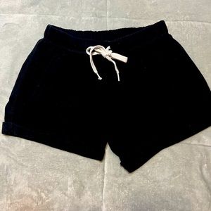 Pink size small black shorts.